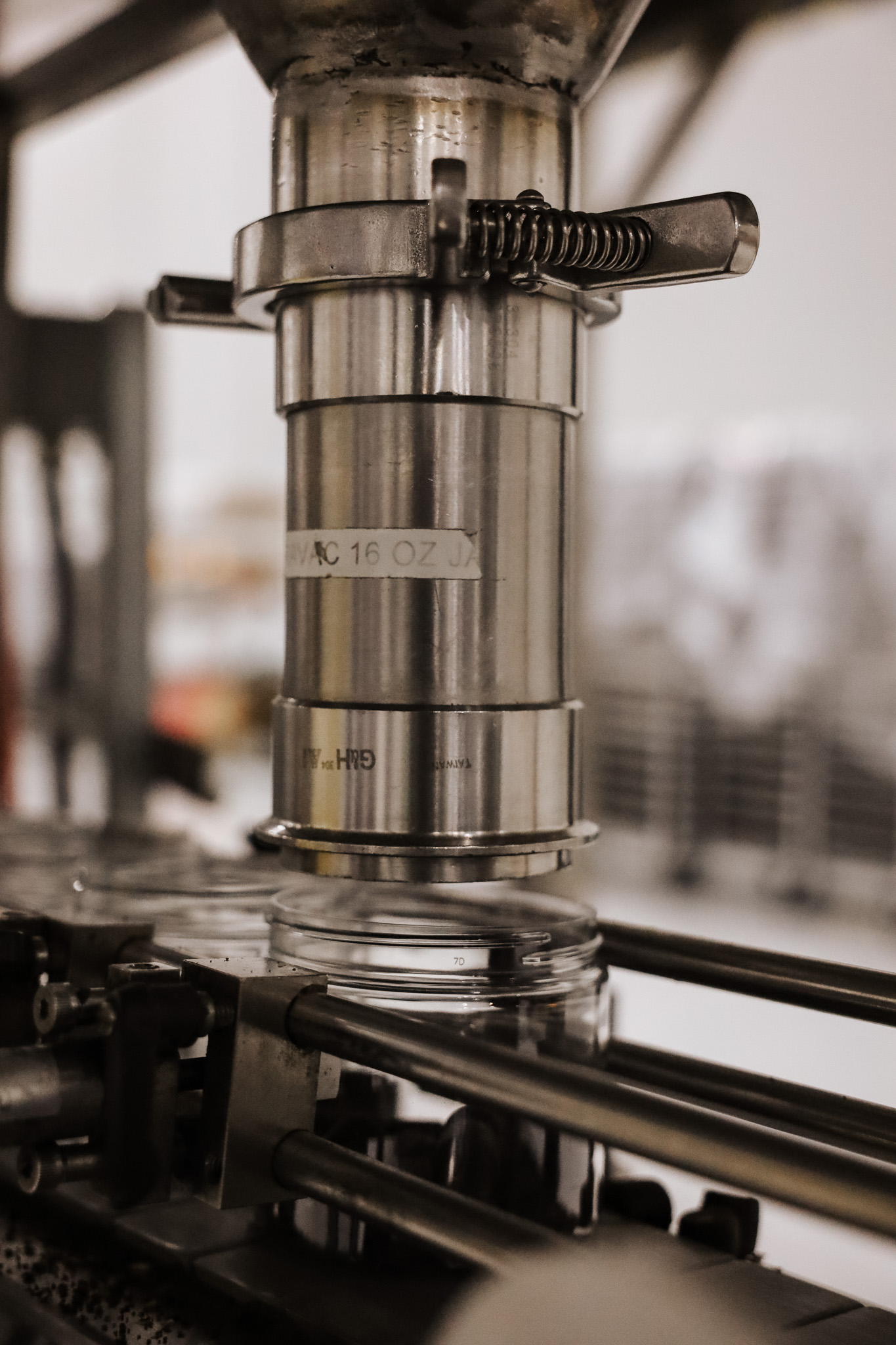 Close up of the machinery pouring canine supplements into the bottles